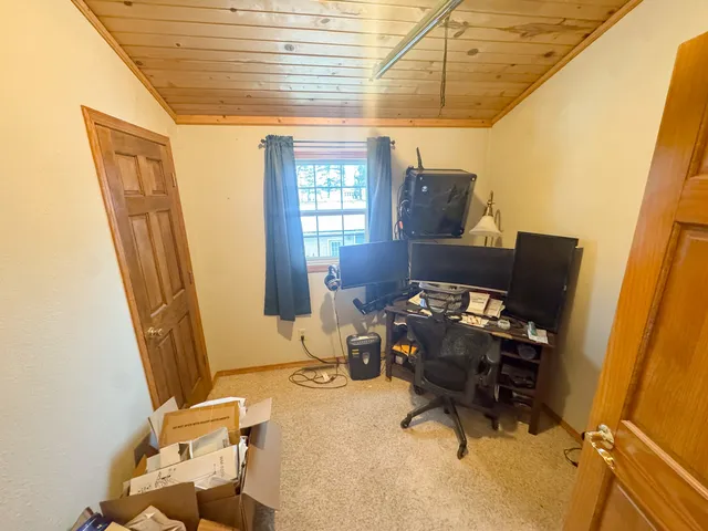 a workspace with furniture and a window