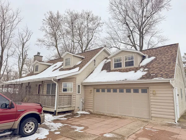 a front view of a house with parking space