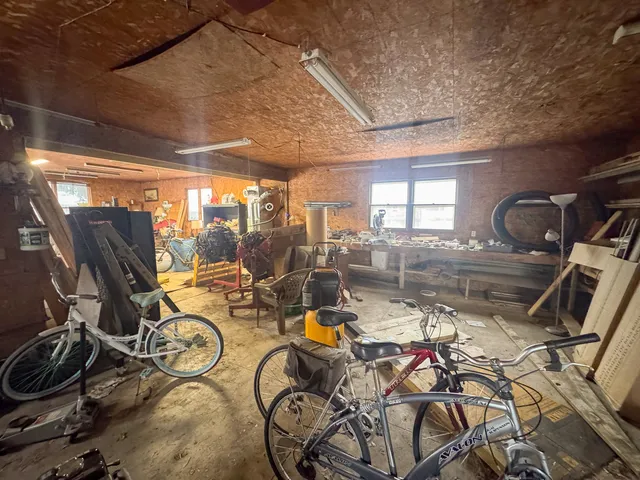 a view of staircase with wooden door and chair