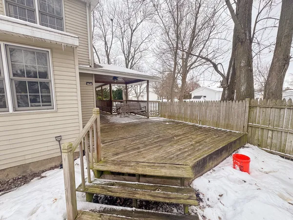 a view of a backyard that has a tree