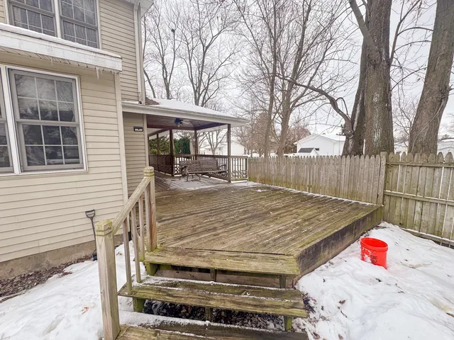 a view of a backyard that has a tree