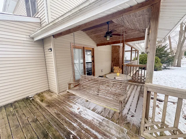 a view of a porch with wooden floor