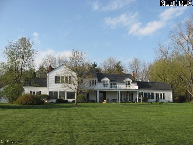 7407 Cedar Road Chesterland, OH 44026 - Photo 14 of 25 Back view of the house showing the balcony over the veranda.