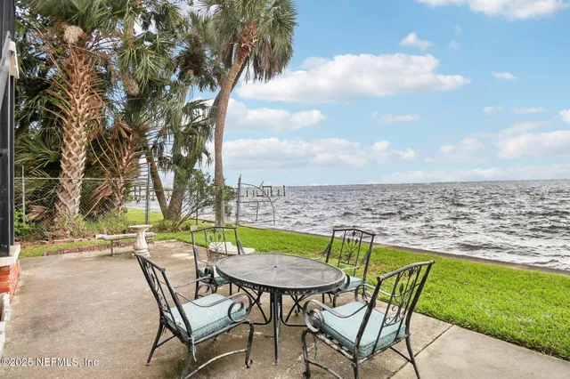 a view of a chairs and table in the patio