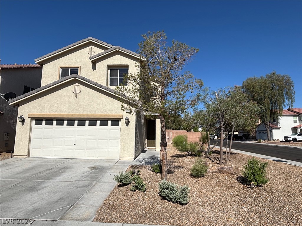 4900 Naff Ridge Drive Las Vegas, NV 89131 - Photo 1 of 21 A well-maintained facade features an attached garage and a neatly landscaped front yard.