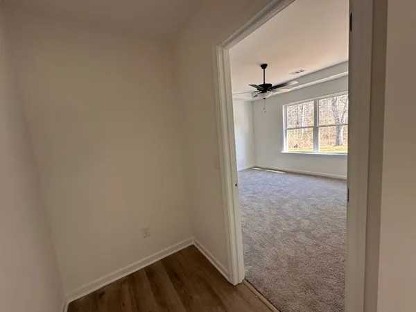 a bathroom with a granite countertop double vanity sink and a mirror