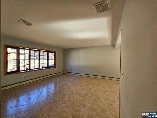 a view of an empty room and window