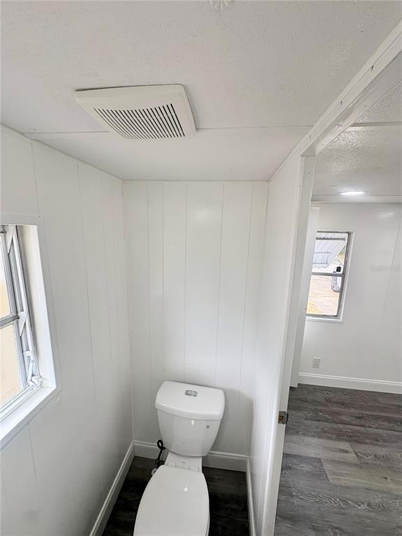 35004 Hawkiowa Road Dade City, FL 33523 - Photo 14 of 28 a bathroom with a toilet and a sink