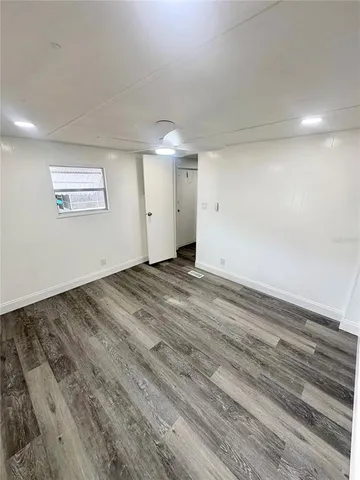 a view of a refrigerator in kitchen and wooden floor