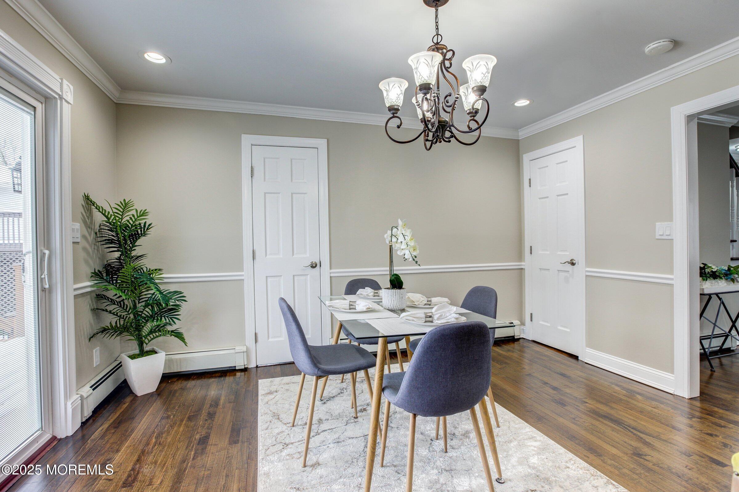 119 E Road Belford, NJ 07718 - Photo 10 of 21 a view of a dining room with furniture wooden floor and chandelier