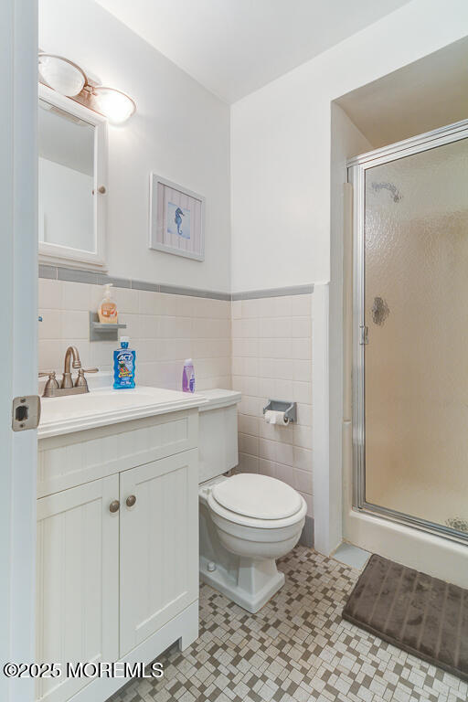 10 E Street Seaside Park, NJ 08752 - Photo 12 of 26 a bathroom with a sink a toilet and a shower