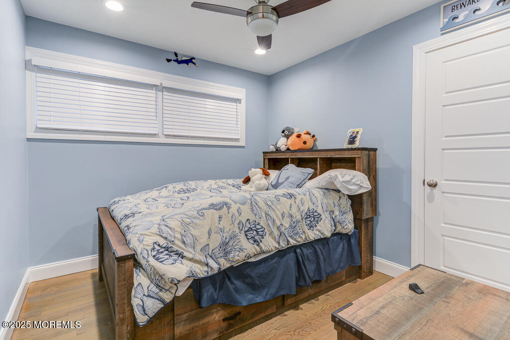 10 E Street Seaside Park, NJ 08752 - Photo 13 of 26 a bedroom with a bed and a window