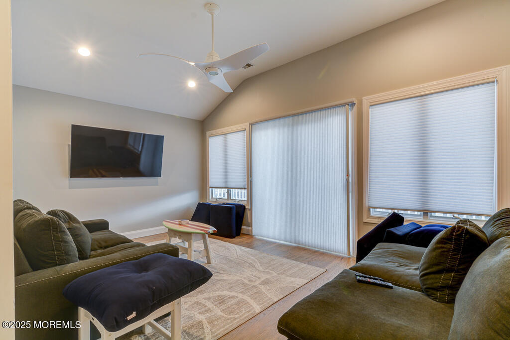10 E Street Seaside Park, NJ 08752 - Photo 15 of 26 a living room with furniture and a flat screen tv