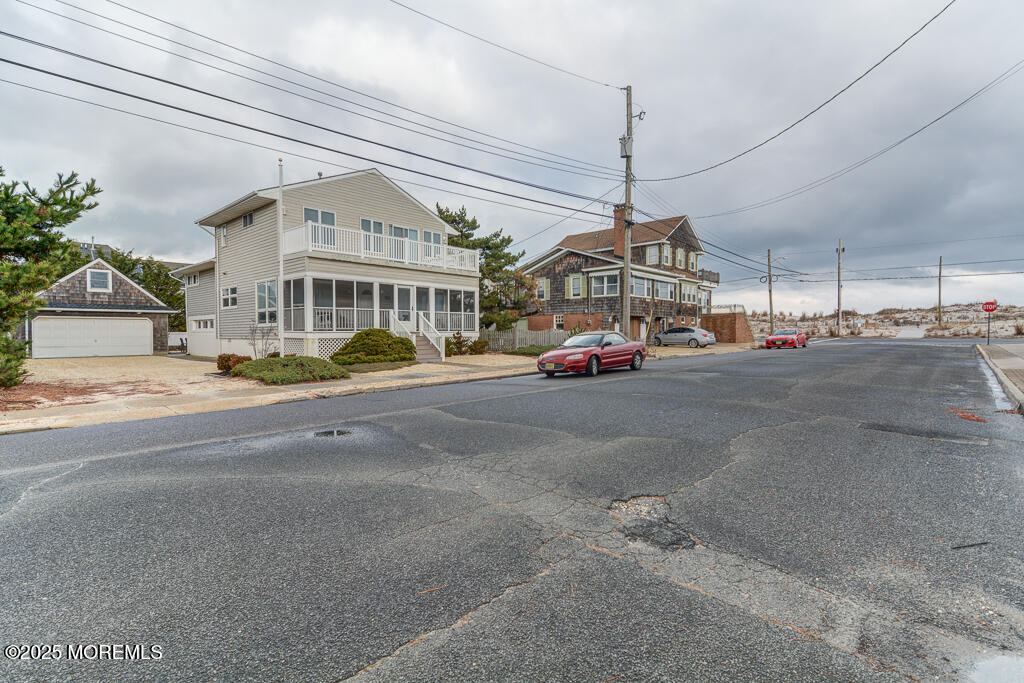 10 E Street Seaside Park, NJ 08752 - Photo 2 of 26 a cars parked in front of a building