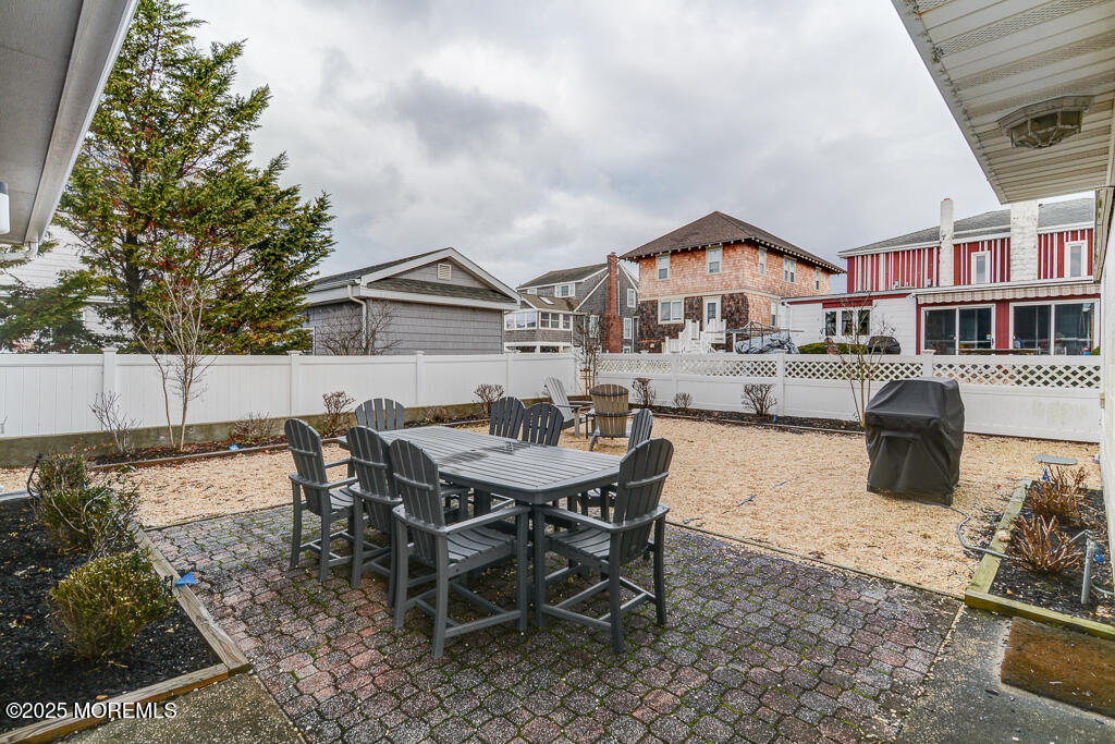 10 E Street Seaside Park, NJ 08752 - Photo 22 of 26 a view of a house with a yard and sitting area