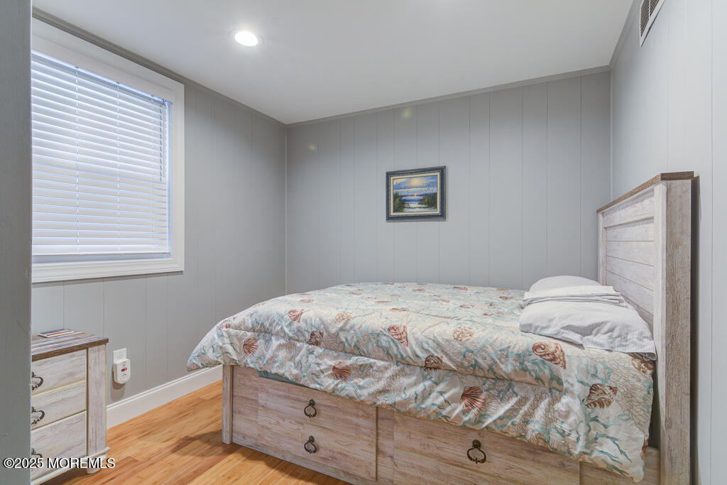 10 E Street Seaside Park, NJ 08752 - Photo 7 of 26 a bedroom with a bed and a window