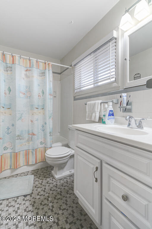 10 E Street Seaside Park, NJ 08752 - Photo 10 of 26 a bathroom with a sink a toilet and shower