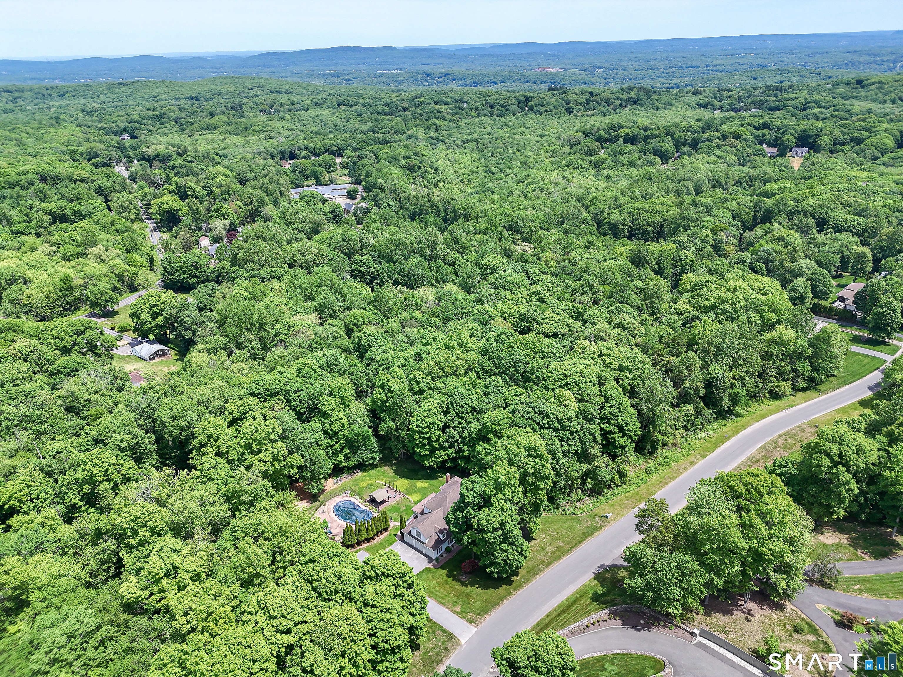 7 Holley Lane Prospect, CT 06712 - Photo 23 of 30 a view of a lush green forest with trees and some houses