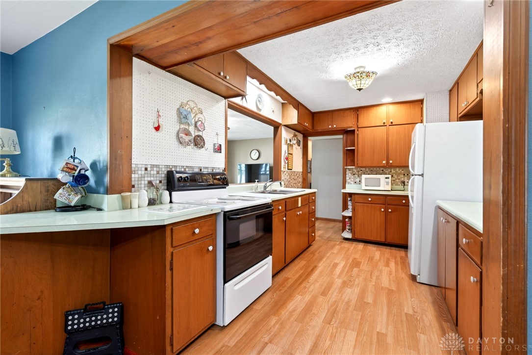 2470 Clark Run Road Xenia, OH 45385 - Photo 7 of 57 This spacious kitchen offers ample cabinetry and counter space, perfect for culinary endeavors.