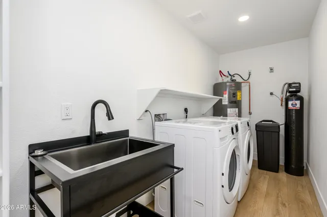 a utility room with dryer and washer