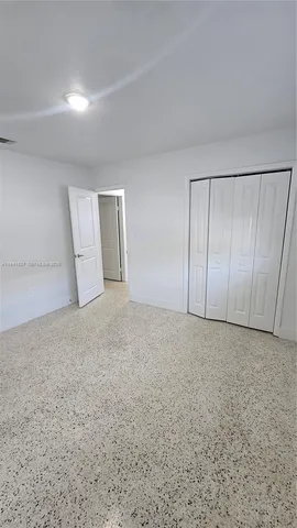 a view of an empty room and entryway