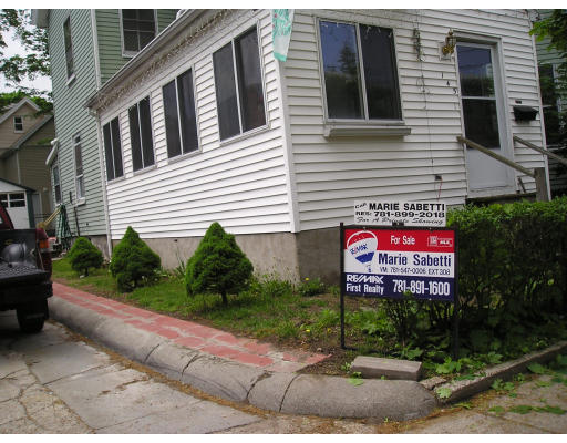 145 Robbins Street Waltham, MA 02453 - Photo 2 of 4 a sign on the side of a building