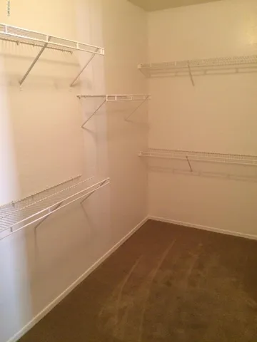 a view of a room with racks on the wall