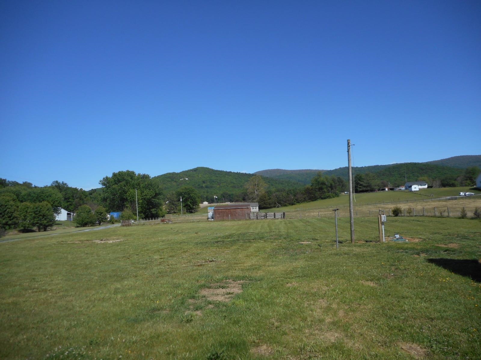18874 Huckleberry Road Elkton, VA 22827 - Photo 7 of 23 a big yard with lots of green space and mountain view