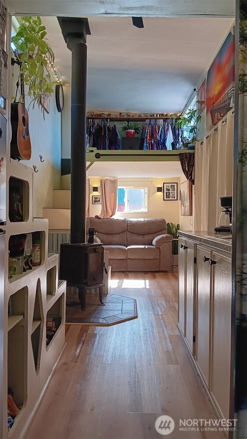 47367 State Rte 20 Concrete, WA 98237 - Photo 13 of 15 a view of a living room with furniture and a fireplace