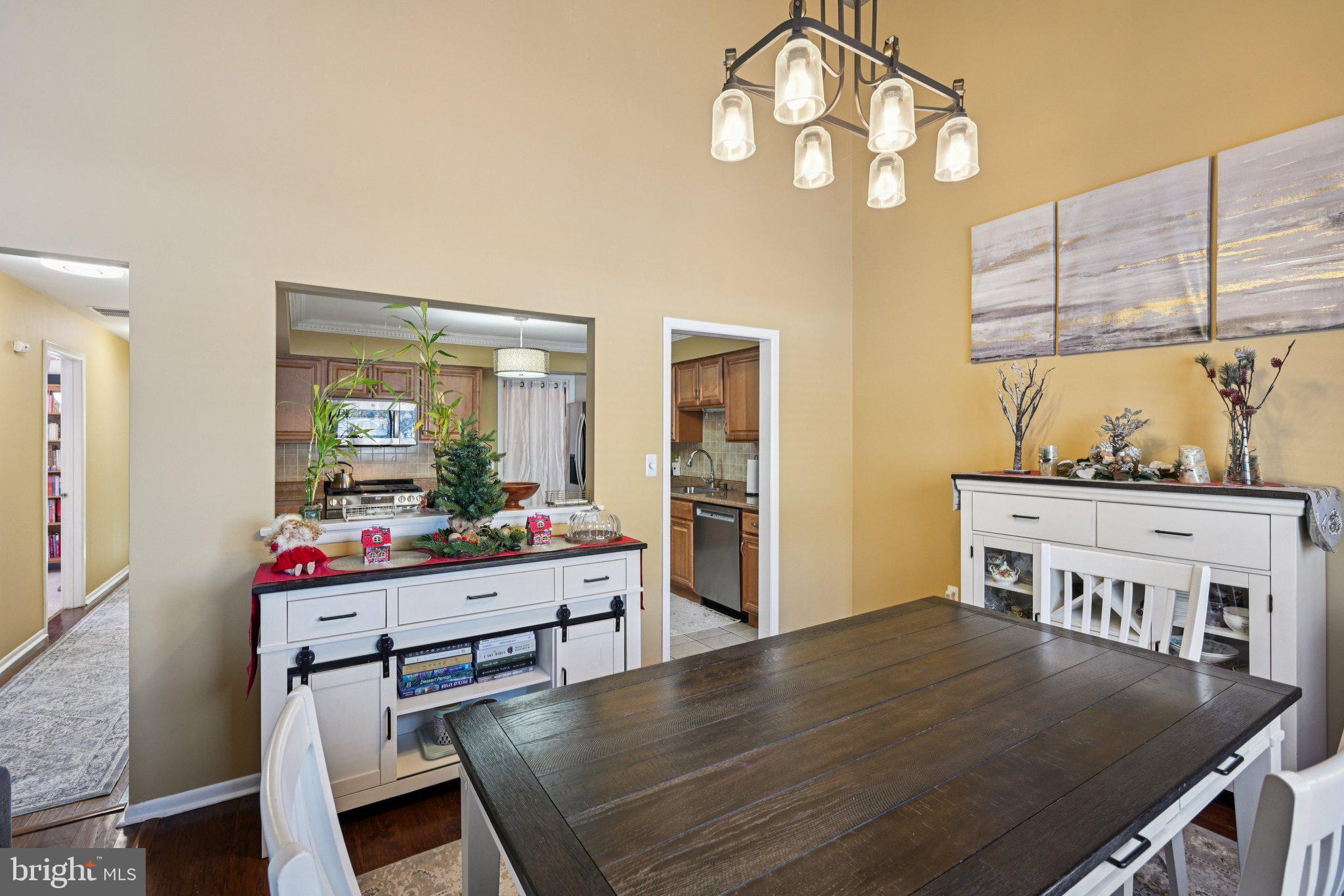 18 Jacob Court Trenton, NJ 08628 - Photo 13 of 43 a living room with a dining table and chairs with wooden floor