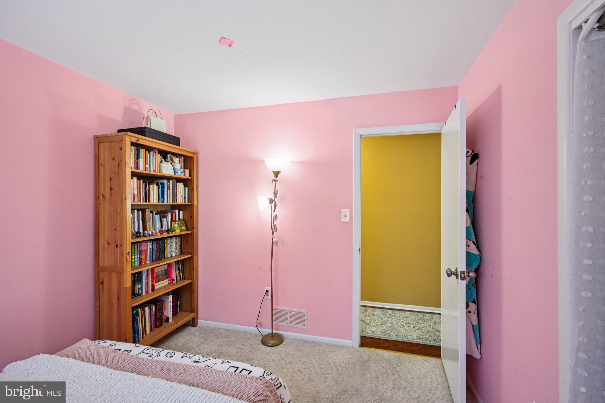 18 Jacob Court Trenton, NJ 08628 - Photo 23 of 43 a bedroom with a bed and a book shelf