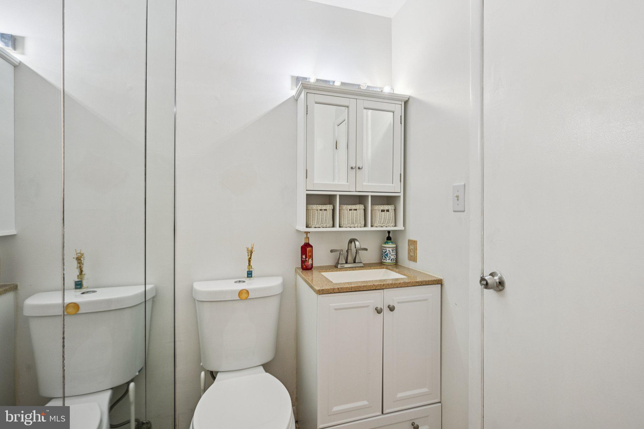 18 Jacob Court Trenton, NJ 08628 - Photo 25 of 43 a bathroom with a toilet sink and mirror