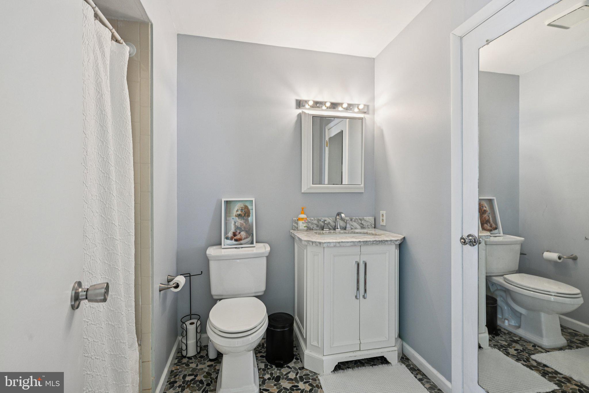 18 Jacob Court Trenton, NJ 08628 - Photo 27 of 43 a bathroom with a toilet sink and mirror