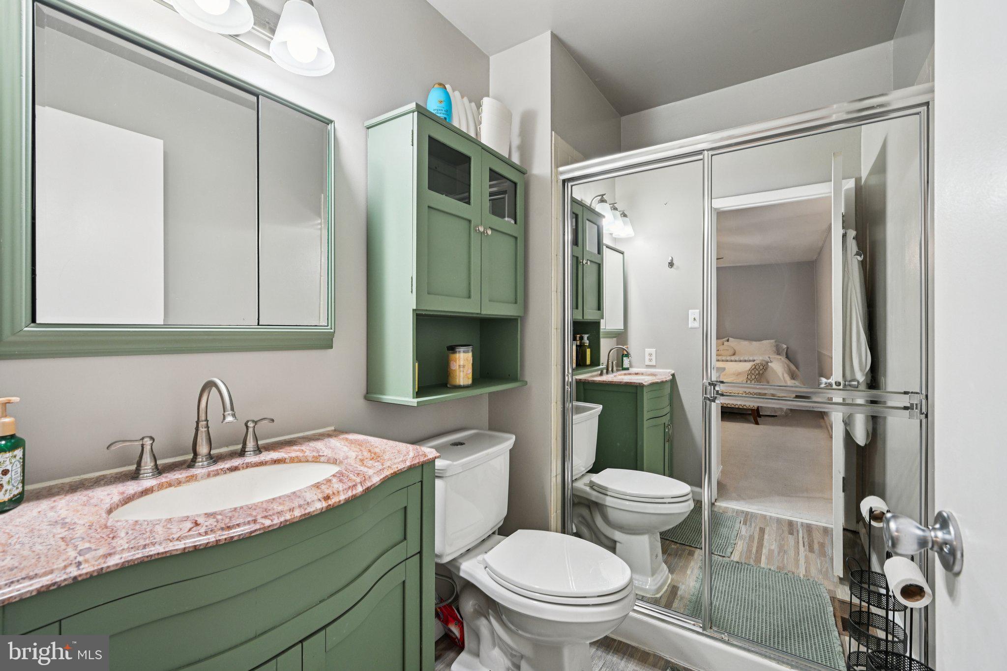 18 Jacob Court Trenton, NJ 08628 - Photo 34 of 43 a bathroom with a granite countertop sink toilet mirror and a bathtub