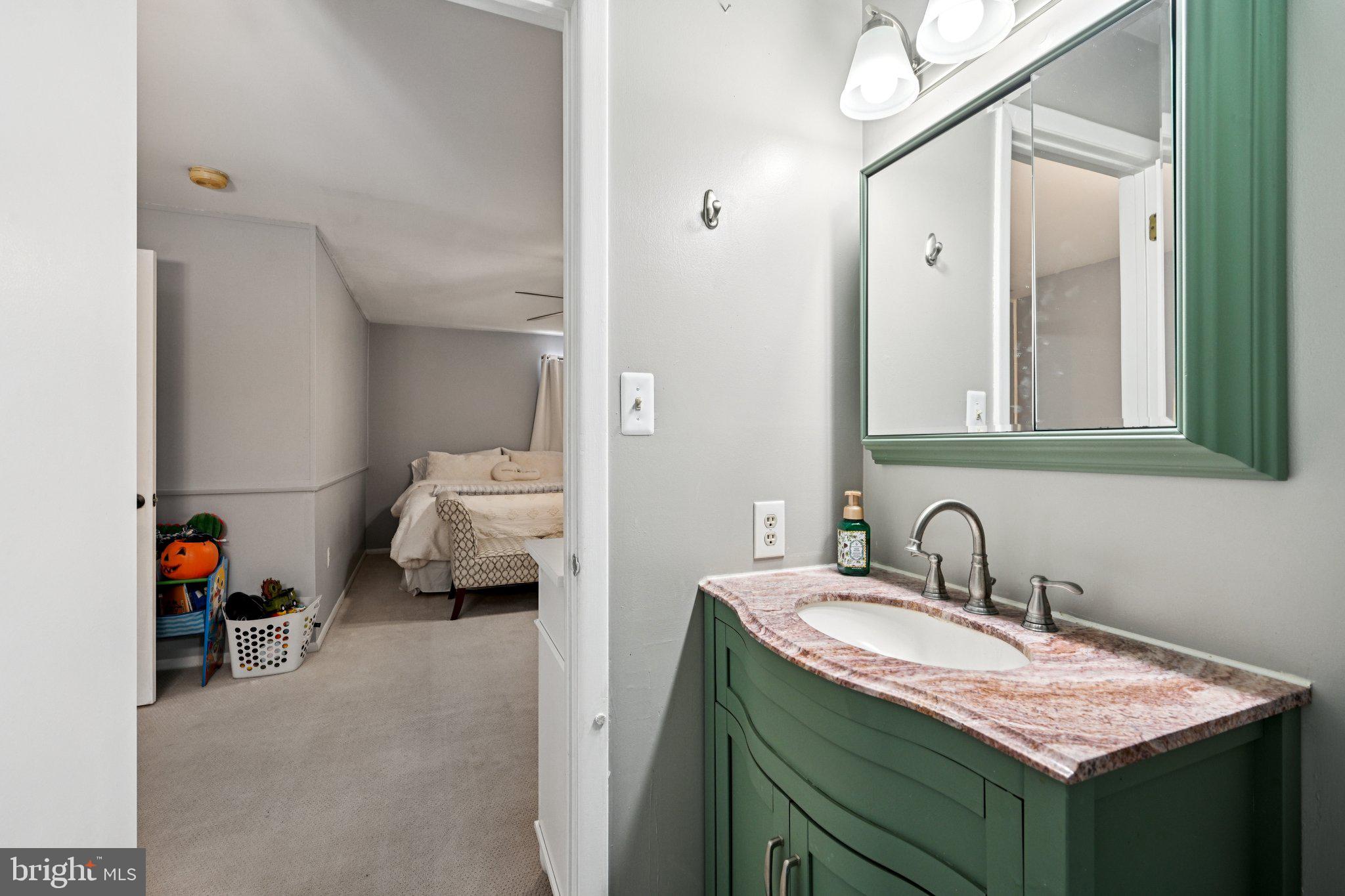 18 Jacob Court Trenton, NJ 08628 - Photo 35 of 43 a en suite bathroom with a sink and a mirror