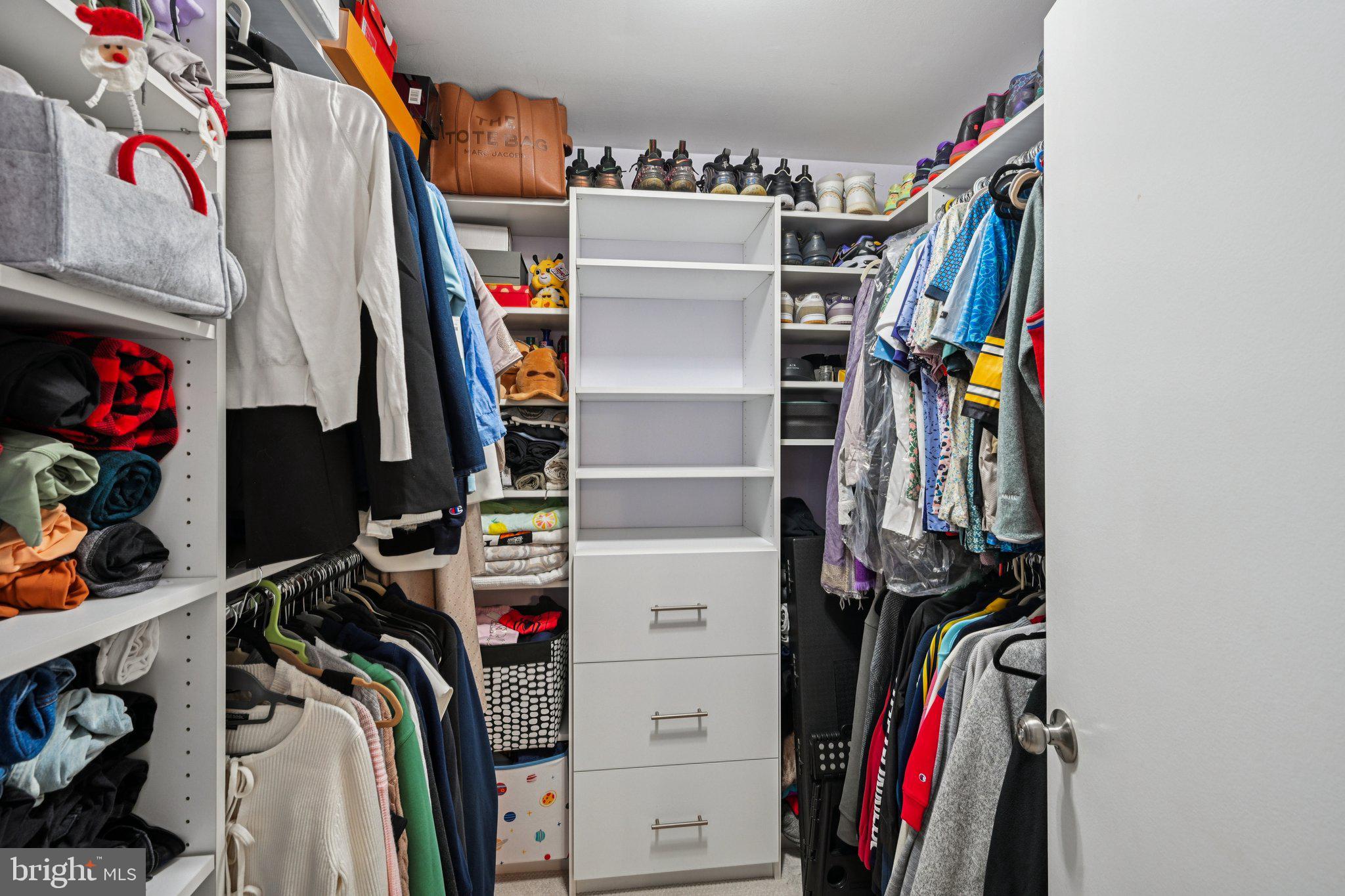18 Jacob Court Trenton, NJ 08628 - Photo 36 of 43 a view of walk in closet with clothes and shoes