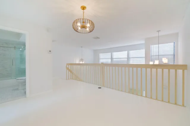 a view of an empty room and a window