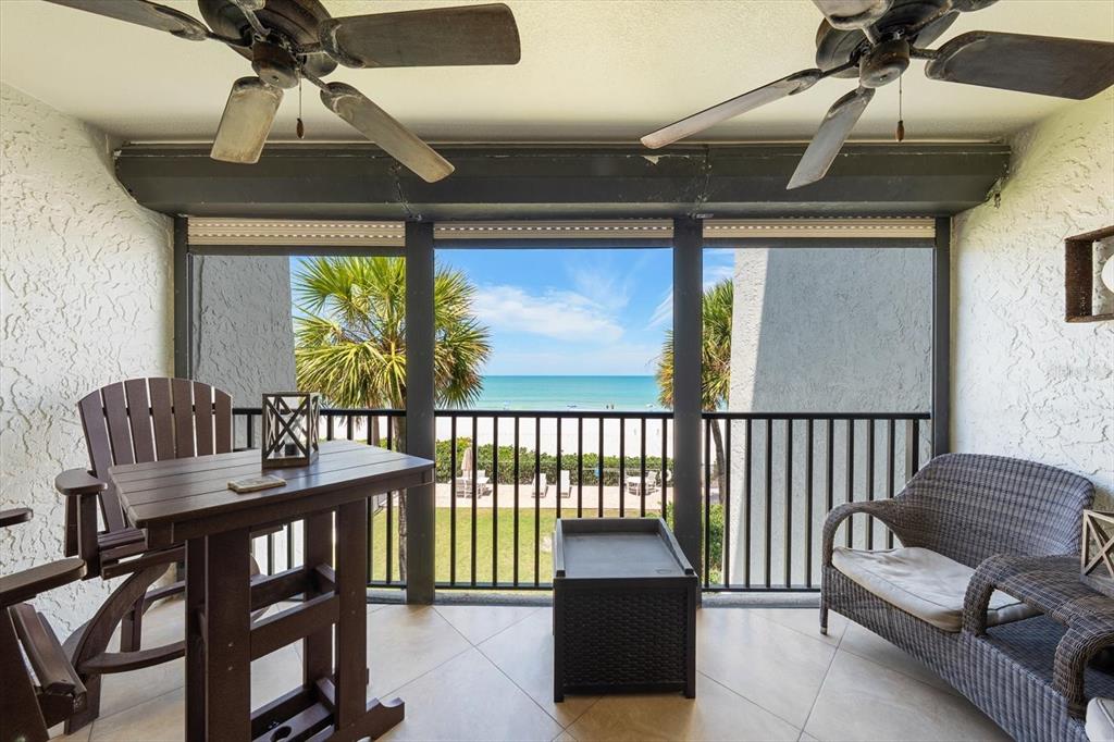 506 Gulf Boulevard, Unit 201 Indian Rocks Beach, FL 33785 - Photo 11 of 30 a balcony with furniture