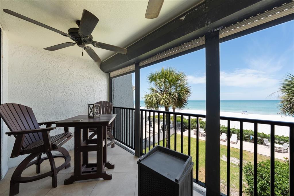 506 Gulf Boulevard, Unit 201 Indian Rocks Beach, FL 33785 - Photo 12 of 30 a view of a chairs and table in the balcony