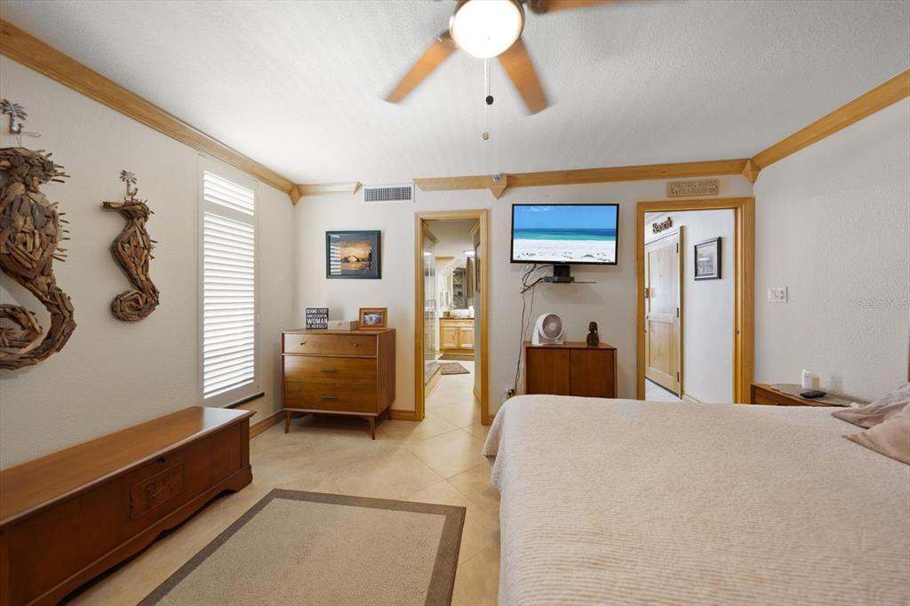 506 Gulf Boulevard, Unit 201 Indian Rocks Beach, FL 33785 - Photo 21 of 30 a bedroom with furniture and a window