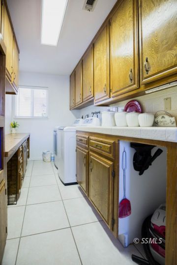 500 Scott Street Ridgecrest, CA 93555 - Photo 16 of 37 a utility room with a sink washer and dryer
