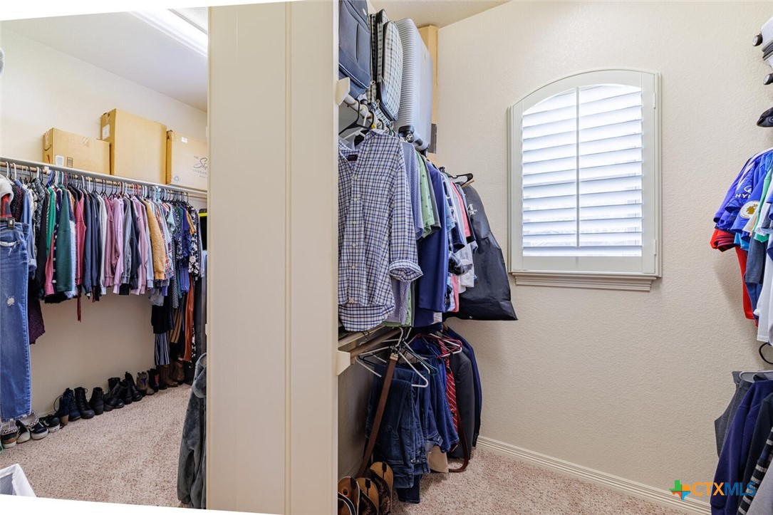 910 Ridgeoak Drive Belton, TX 76513 - Photo 12 of 48 a view of walk in closet with clothes