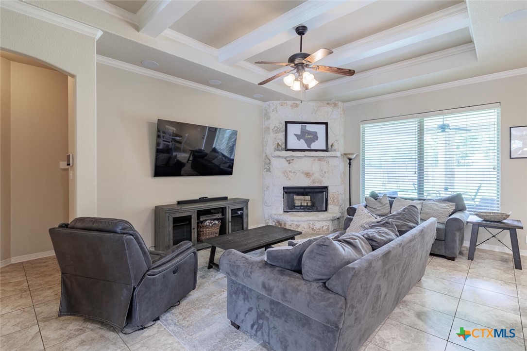 910 Ridgeoak Drive Belton, TX 76513 - Photo 15 of 48 a living room with furniture a flat screen tv and a fireplace