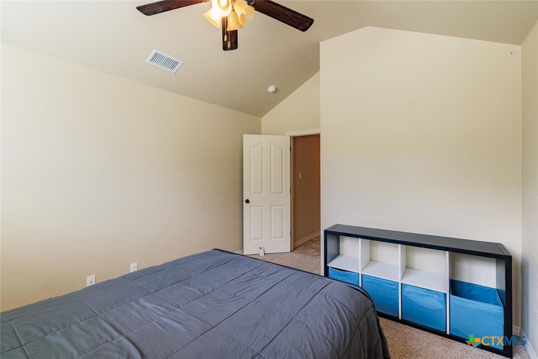910 Ridgeoak Drive Belton, TX 76513 - Photo 30 of 48 a bedroom with a bed and a ceiling fan
