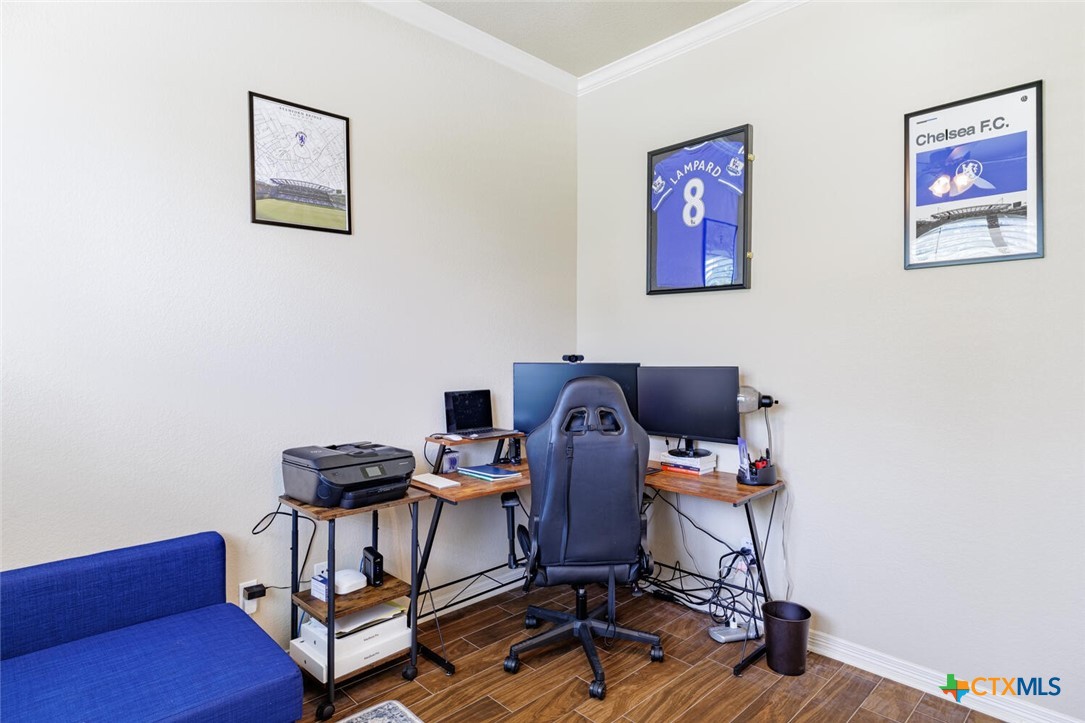 910 Ridgeoak Drive Belton, TX 76513 - Photo 3 of 48 a view of a workspace with furniture and wooden floor