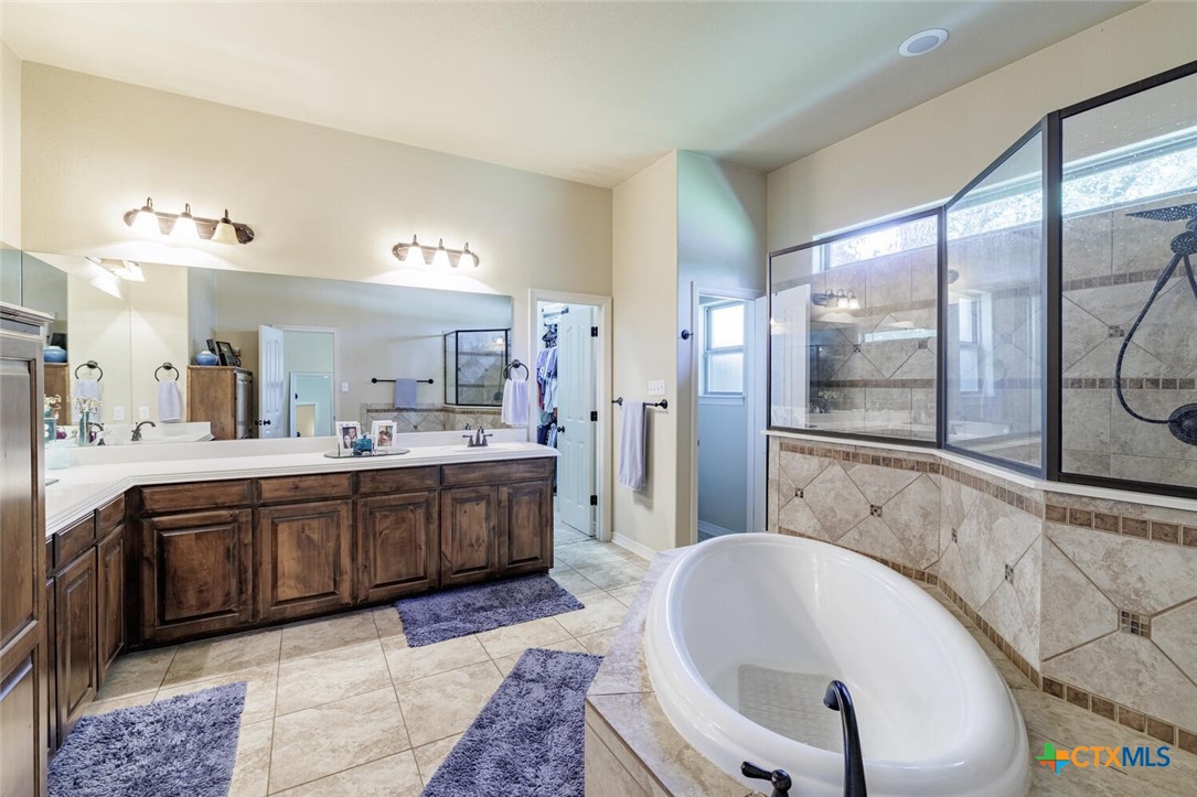 910 Ridgeoak Drive Belton, TX 76513 - Photo 10 of 48 a large bathroom with a large tub sink shower and mirror