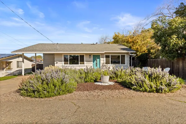 front view of a house with a small yard