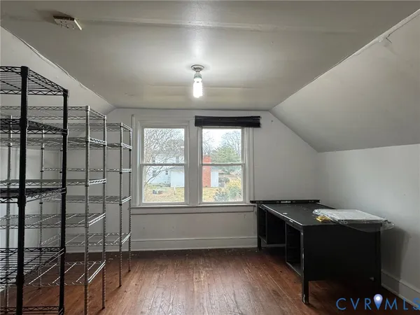 a room with air conditioner and windows