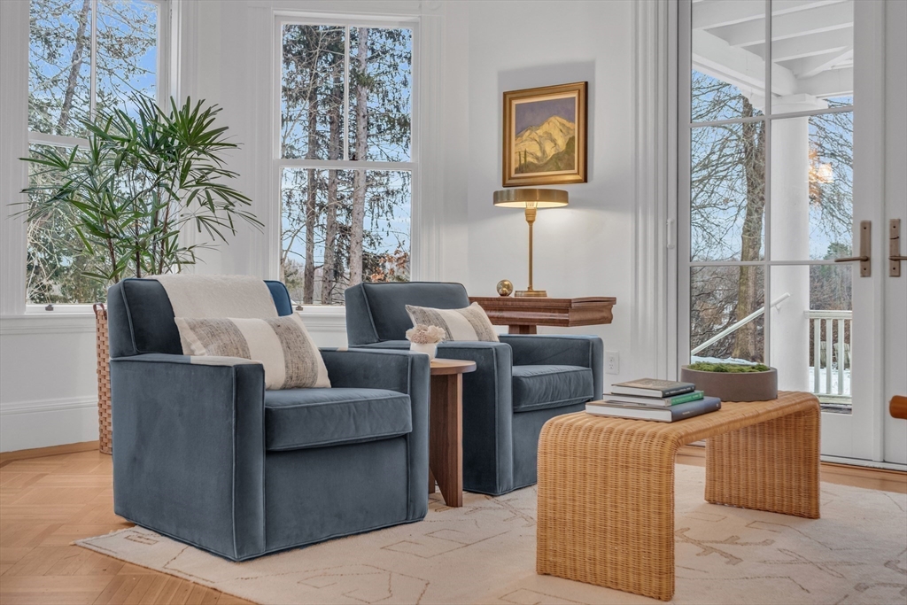 93 Coolidge Road Concord, MA 01742 - Photo 12 of 42 a living room with furniture and a potted plant
