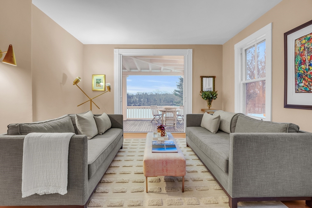 93 Coolidge Road Concord, MA 01742 - Photo 15 of 42 a living room with furniture and a large window